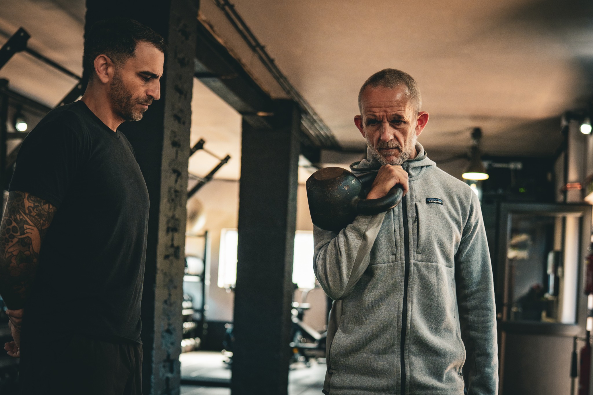 Gil Sassi coaching a client through kettlebell training
