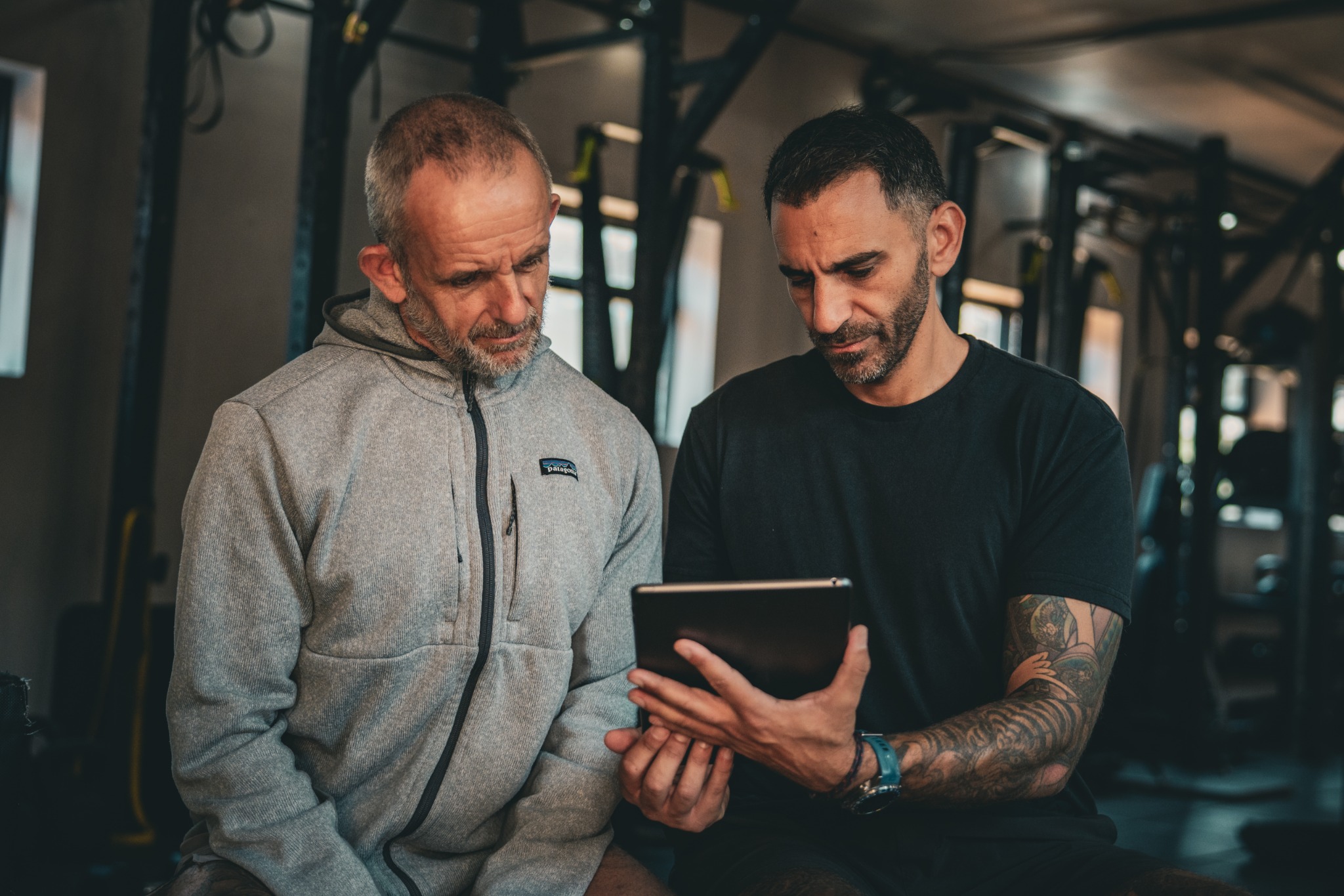 Gil Sassi reviewing a training plan with a client