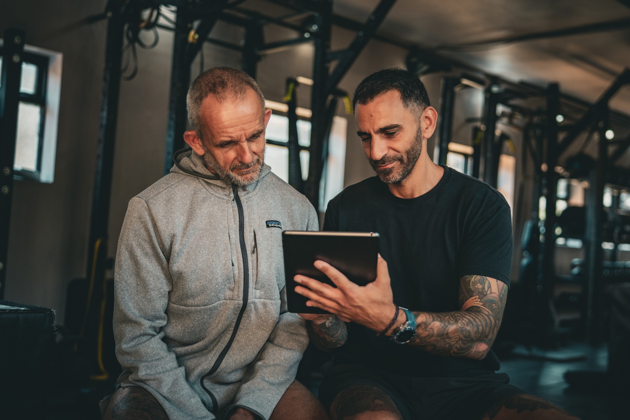Gil Sassi reviewing a training plan with a client